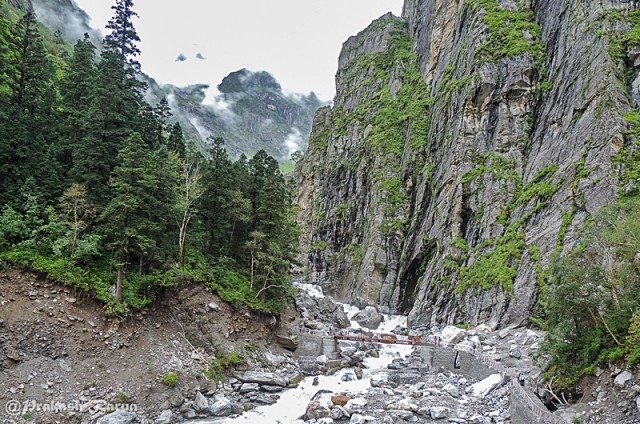You need to crossover that little bridge on river Pushpawati to get into the Valley