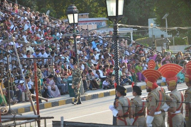 Security personnel and participants to the closing ceremony checking the readiness